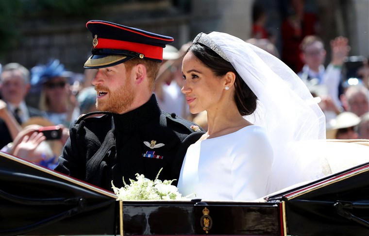 The Duke and Duchess of Sussex greeting the 2600 invited guests on the grounds of Windsor Castle after their royal wedding